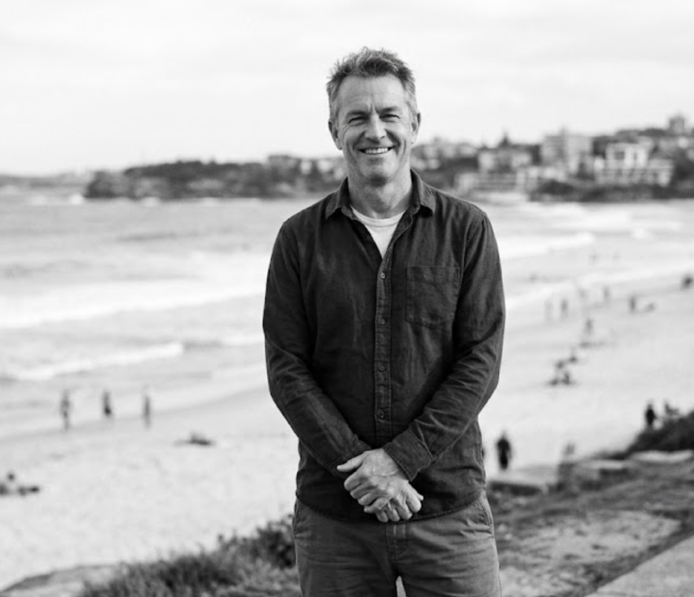 Alex Busse, Sydney-based nutritionist, standing at Bondi Beach